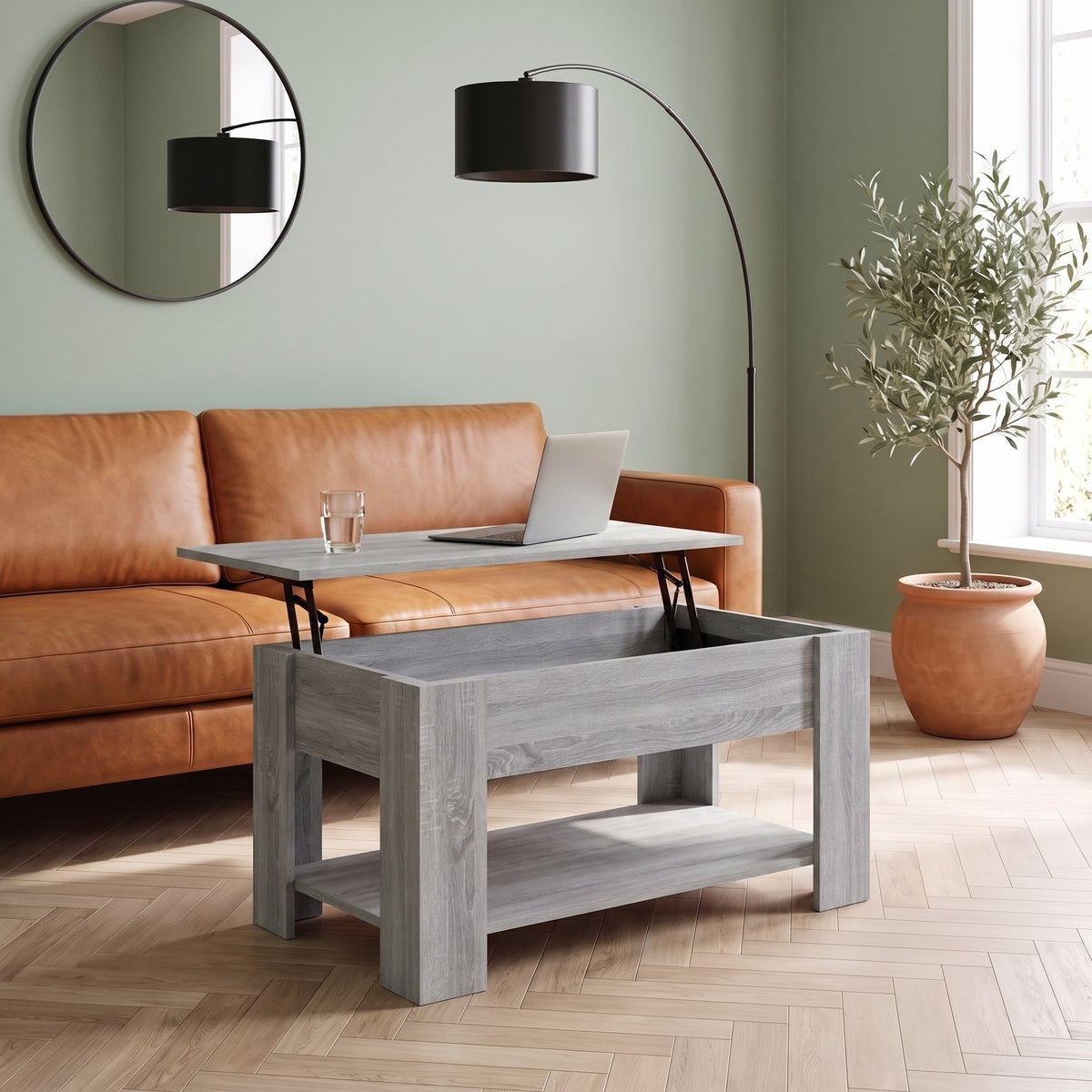 Table Aveline Sonoma gris plateau relevé avec ordinateur portable dans un salon #Dimensions_101 × 49 × 52 cm #Couleur_Sonoma gris