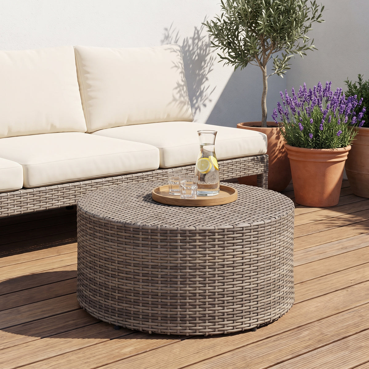 Table ronde extérieur Tonda, gris chiné, sur une terrasse en journée #Couleur_Gris