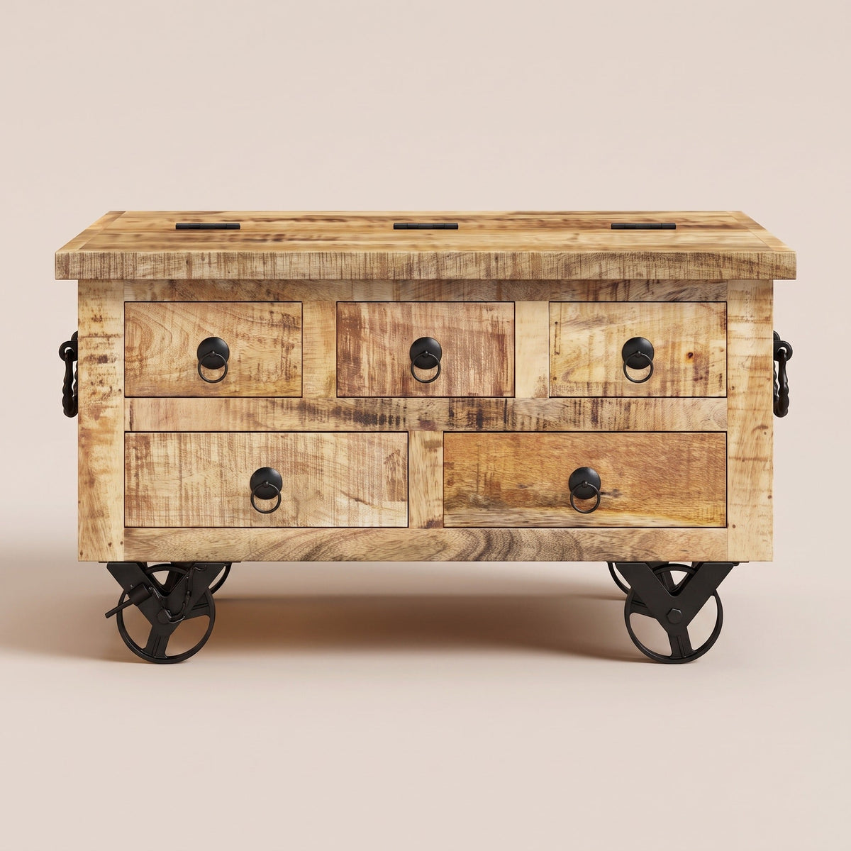 Table Origo de face : cinq tiroirs à anneaux forgés en manguier brut
